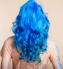 blue hair hairstyle curls girl's back bright hair color creative painting in a bright shade colorist work summer style
