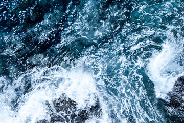 Obraz na płótnie Canvas Blue deep sea foaming water background
