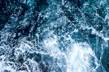 Blue deep sea foaming water background
