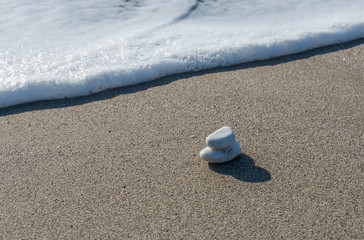 White Stones on a Southern Italian Mediterranean Beach with Foam