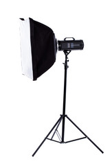 Side view studio flash with clipping path. Studio flash with square soft box on stand. Flashlight and outbreak. Isolated on white background.