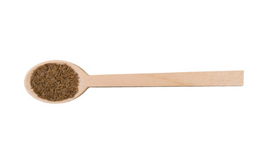 caraway seeds on wooden spoon isolated on white background