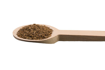 caraway seeds on wooden spoon isolated on white background