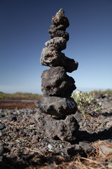Fototapeta na wymiar Built tower of stones. Balance in nature.