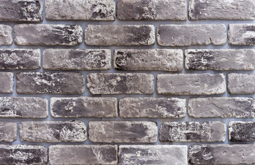 Texture of gray bricks with black accents.
