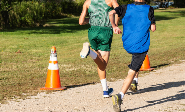 Two High School Boys Running A Cross Country Race