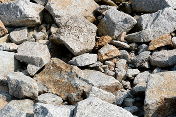 Fototapeta na wymiar The stones that are stacked together, both small and large, are mixed together.