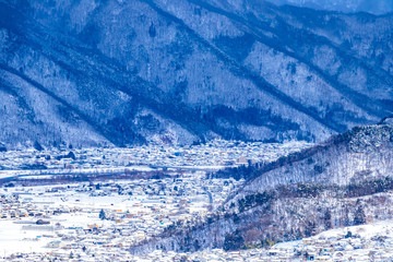 Fototapeta na wymiar Snowy countryside view in the winter of Japan.