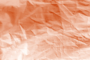 Fototapeta premium Elegant orange textile background. Silk cloth texture. Fabric pattern.