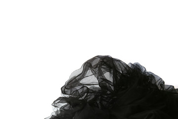 Abstract composition of black tulle material  isolated on white background. Waving shape of tulle fabric with copy space.