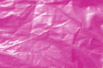 Obraz premium Elegant pink textile background. Silk cloth texture. Fabric pattern.