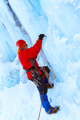 climber doing steps in the ice with an ice ax