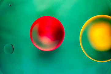 Red and yellow balls on green background