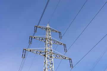high voltage post.High-voltage tower sky background in Germany