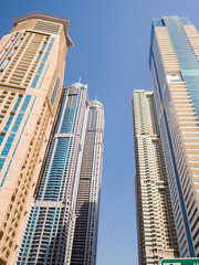 Fototapeta na wymiar High-rise skyscrapers with blue sky of Dubai city. UAE.