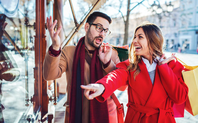Young couple in shopping. Consumerism, love, dating, lifestyle concept
