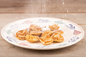 pancakes, poffertjes with powdered sugar