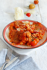 Baked pasta with tomato sauce and mozzarella cheese