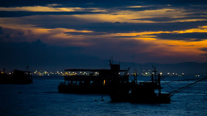 Fototapeta premium The Boat on sea with sunrise.