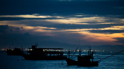 Fototapeta premium The Boat on sea with sunrise.