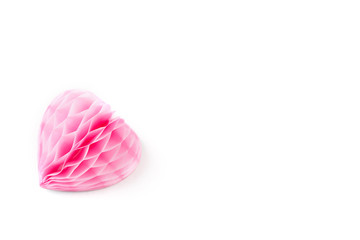 A lush pink paper heart on a white background.