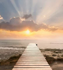 Foto op Canvas Wood bridge on the sea which has walk way for travel with beautiful sky and sunshine background. © nicemyphoto