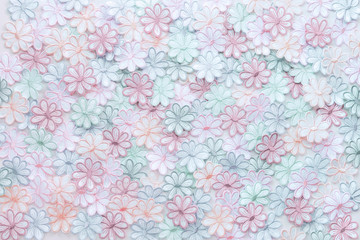 Embroidery colorful flowers pattern texture on a white background for design work texture or decorate wedding invitation greeting card background.