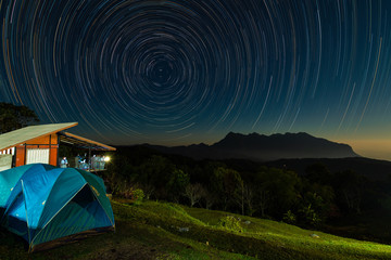 Star trail above Doi Luang mountain seen from Doi Ma Taman camping site, Chiang Mai, Thailand