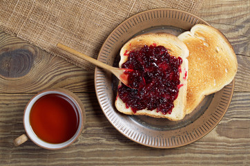 Tea and toasted bread with jam