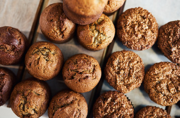 Assortment of delicious muffins sitting on a serving boards