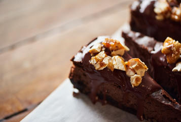 Delicious slices of nutty chocolate cake sitting on a table