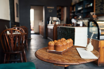 Delicious muffins sitting together on a bakery table