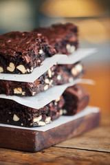Stack of delicious chocolate brownies sitting on a bakery table