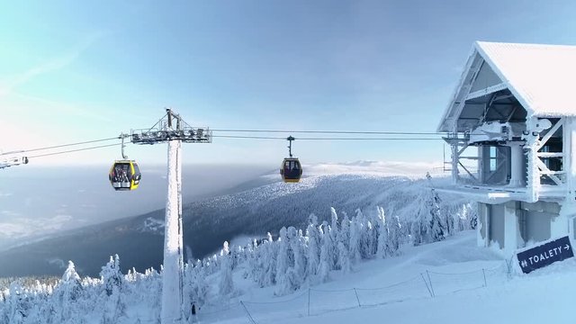 Aerial view of Izera mountains in winter, sunny day with blue sky - ski resort Swieradow Zdroj, landscape panorama of Poland, Europe