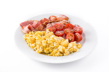 Breakfast with scrambled eggs, bacon and tomatoes isolated on white background