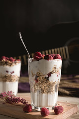 Yogurt parfait with granola and fresh raspberries