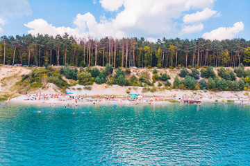 aerial view of lake shore in sunny day.