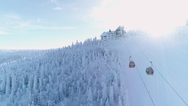 Aerial view of Izera mountains in winter, snow on slopes, sunny day with blue sky - ski resort Swieradow Zdroj, Poland, Europe