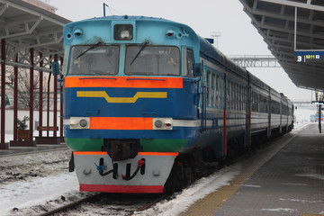 the old train stands at the railway station, waiting for departure and passengers. travel around the world on retro transport
