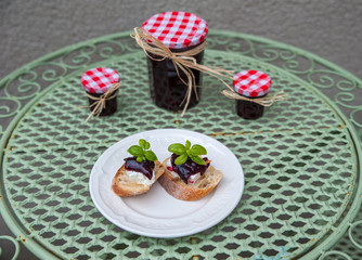 Homemade sloe jams on the rustic table