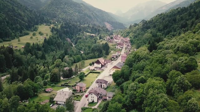 Drone shot showing a village in the Italian side of the Alps. Drone flight in South Tyrol in 4k