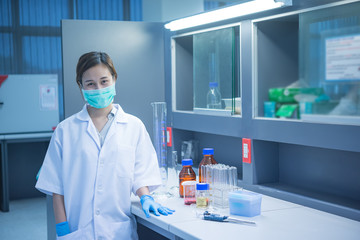 Asian scientist working in the lab,Doing experiment for product,The researchers analyzed to find the results of the experiment.