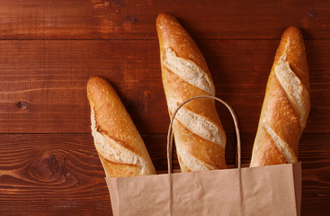 fresh bread in a paper bag. small bakery concept with gluten free flavored bread