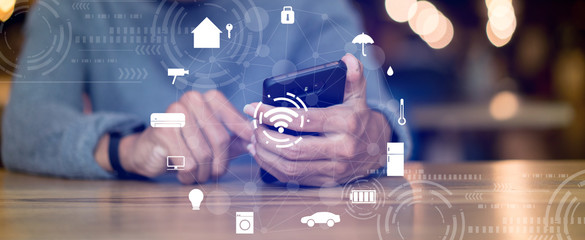 close up man hand press on display smartphone  turn on wifi technology for using home automation function to looking inside or outside home and property , ai innovation future concept	
