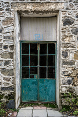 Fototapeta na wymiar Door at Berengaria abandoned hotel in mountain region of Trodos, Cyprus