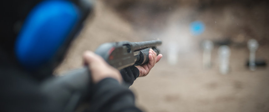 Combat shotgun shooting training. Long gun, pump gun and scattergun