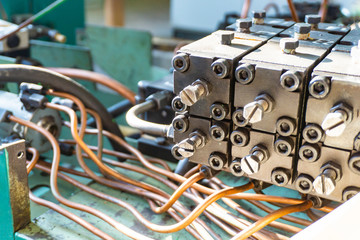 The hydraulic system of the metalworking machine is being repaired.