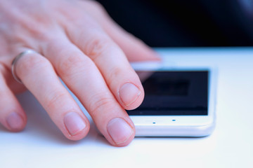 Close up of a man using touch screen device. Remotely work concept.