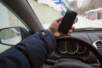 Man talking on the phone while driving a car