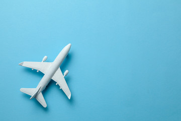 White passenger plane on blue background. Copy space for text.